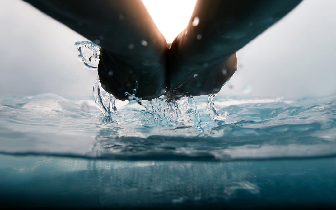 Two hands cupping fresh clear water